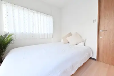 a white bedroom with a white bed and a window at Ueno Luxury 161m2 Villa 6BR 3Bath 4Toilet 3m to Train Skytree View in Tokyo