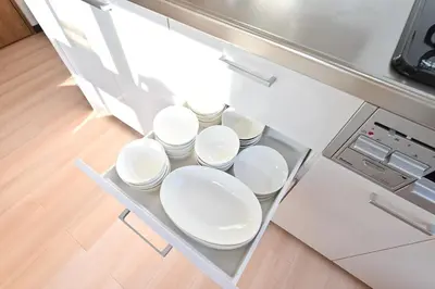 a group of white dishes on a tray in a kitchen at Ueno Luxury 161m2 Villa 6BR 3Bath 4Toilet 3m to Train Skytree View in Tokyo