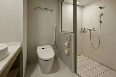 a bathroom with a toilet and a sink and a shower at Four Points Flex by Sheraton Tokyo Ueno in Tokyo