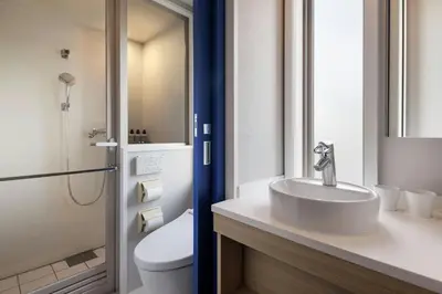 a bathroom with a sink and a toilet at Four Points Flex by Sheraton Tokyo Ueno in Tokyo