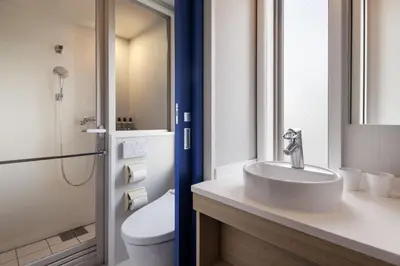 a bathroom with a sink and a toilet at Four Points Flex by Sheraton Tokyo Ueno in Tokyo