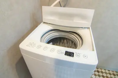 a washer and dryer in a small room at Yoyogi Apartment 1-401 by Tranova in Tokyo