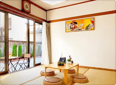 a living room with a coffee table and a balcony at TOKYO/Shinjuku & Shibuya 10mins/5mins walk to subway stiaon/Kichijoji 15mins/Shimokitazawa 5mins/Louis House in Tokyo