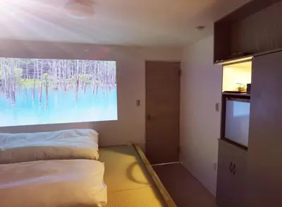 a room with a bed and a flat screen tv at belle via tokyo - Vacation STAY 61564v in Tokyo