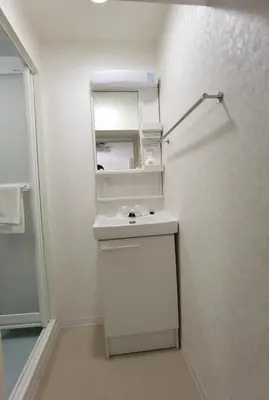 a bathroom with a white sink and a mirror at belle via tokyo - Vacation STAY 60795v in Tokyo