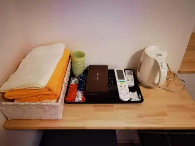 a wooden table with a shelf with a sewing machine at belle via tokyo - Vacation STAY 58509v in Tokyo