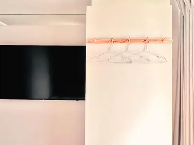 a shelf with three wine glasses on a wall at \u4e1c\u4eac\u4e0a\u91ce\u8d85\u7ea7\u4e2d\u5fc3 \u8bbe\u8ba1\u5e08\u623f\u95f4Yaob \u4e0a\u91ce\u516c\u56ed3\u5206\u949f \u8f66\u7ad91\u5206\u949f \u8d85\u7ea7\u7e41\u534e \u514d\u8d39wifi \u6234\u68ee\u5439\u98ce in Tokyo