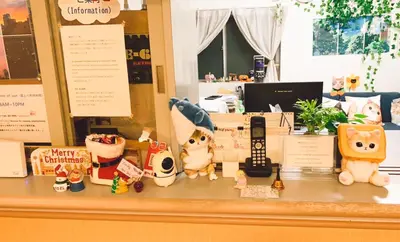 a counter with stuffed dogs and other toys on it at Hotel Yuni Star-Club in Tokyo