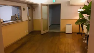 an empty room with a hallway with a door and a floor at Hotel Yuni Star-Club in Tokyo