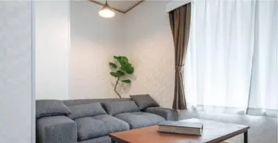 a living room with a couch and a table at \u7b39\u585a\u6238\u5efa in Tokyo
