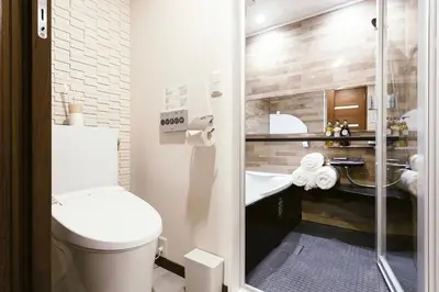 a bathroom with a shower with a toilet and a sink at 超级奢华 近秋叶原东京站Kaoa奢华套房带厨房 超豪华戴森&POLA顶级配置 4分钟到东京站 3分钟到地铁 in Tokyo