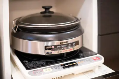 a slow cooker sitting on top of a stove at THE VILLA TAKADANOBABA in Tokyo