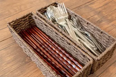 a basket of utensils sitting on a table at \u65b0\u5bbf6\u4e01\u76ee\u6238\u5efa in Tokyo