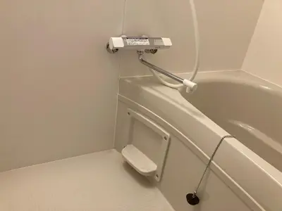 a bathroom with a toilet with a phone on the wall at Sky Tree INN (\u6674\u6a39\u5bbf\uff09stay ASAKUSA in Tokyo