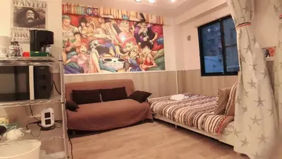 a room with a couch and a bed in it at Jing House Koiwa - Vacation STAY 63200v in Tokyo