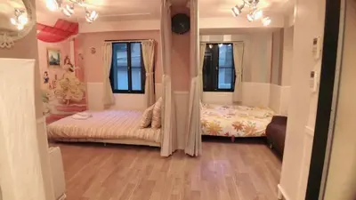 a bedroom with two beds and two windows at Jing House Koiwa - Vacation STAY 63200v in Tokyo