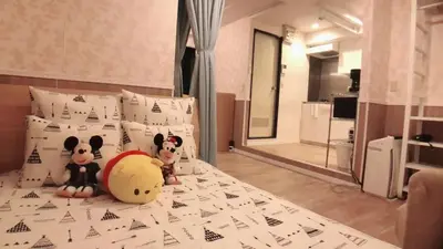 two stuffed animals sitting on a bed in a bedroom at Jing House Koiwa - Vacation STAY 63200v in Tokyo