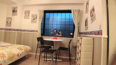 a bedroom with a table and chairs and a window at Jing House Koiwa - Vacation STAY 63200v in Tokyo
