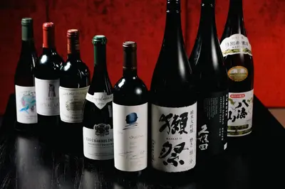 a group of wine bottles sitting on a table at \u4e07\u96f7\u30db\u30c6\u30eb in Tokyo