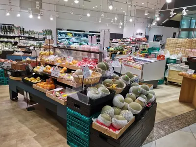a grocery store filled with lots of fruits and vegetables at White house in Tokyo