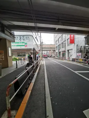 an empty city street with a bridge in the distance at White house in Tokyo