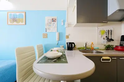 a kitchen with a table with a bowl on it at SC 101 Cozy Private Stay with Loft Near Station Free WiFi in Tokyo