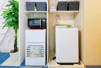 two refrigerators sitting on a shelf in a room at SC 106 Cozy Private Stay with Loft Near Station Free WiFi in Tokyo