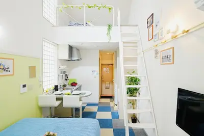 a room with a bunk bed and a kitchen at SC 201 Cozy Private Stay with Loft Near Station Free WiFi in Tokyo