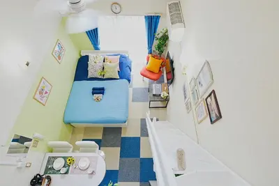 a small room with a blue bed and a sink at SC 203 Cozy Private Stay with Loft Near Station Free WiFi in Tokyo