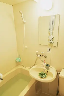 a bathroom with a sink and a shower at SC 203 Cozy Private Stay with Loft Near Station Free WiFi in Tokyo