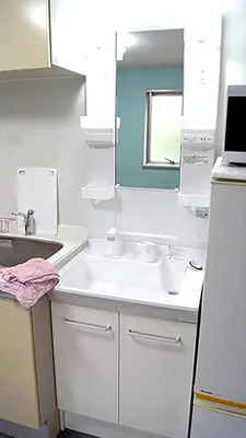 a white kitchen with a sink and a mirror at Space Air Building 3F - Vacation STAY 11441 in Tokyo