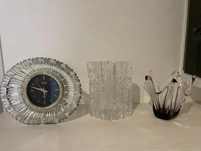 a table with a plate and a clock and a vase at Private Hotel Season Spring - Vacation STAY 71133v in Tokyo