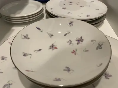 a plate with purple flowers on it next to other plates at Private Hotel Season Spring - Vacation STAY 71133v in Tokyo