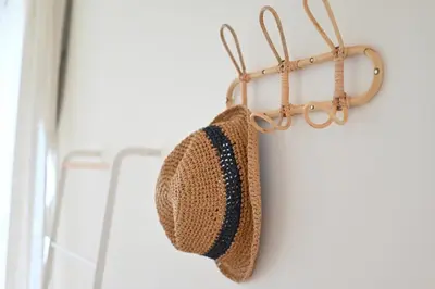 a straw hat is hanging on a wall at Shinjuku-2minutes Shin-Okubo\u99c5 Very good location in Tokyo
