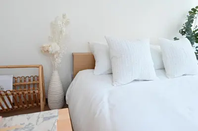 a bedroom with a white bed with white pillows at Shinjuku-2minutes Shin-Okubo\u99c5 Very good location in Tokyo