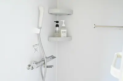 a shower with a faucet and a sink in a bathroom at Shinjuku-2minutes Shin-Okubo\u99c5 Very good location in Tokyo