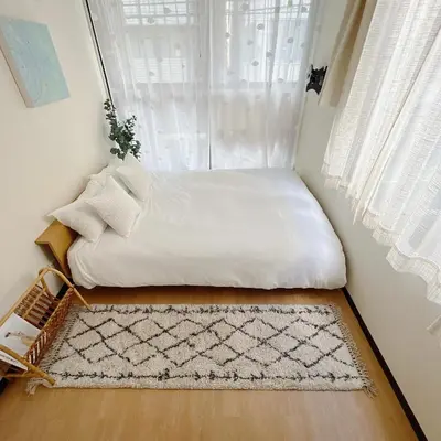 a bed in a room with a window at Shinjuku-2minutes Shin-Okubo\u99c5 Very good location in Tokyo