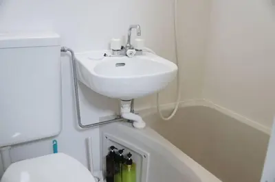a bathroom with a sink and a toilet at TokyoGuest Akihabara in Tokyo