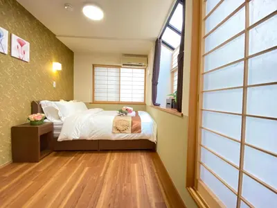 a bedroom with a bed and a window at N9-luxury guest room in Shinjuku in Tokyo