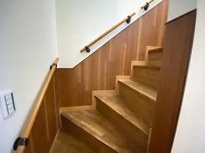 a stairwell with wooden steps and a railing at N9-luxury guest room in Shinjuku in Tokyo