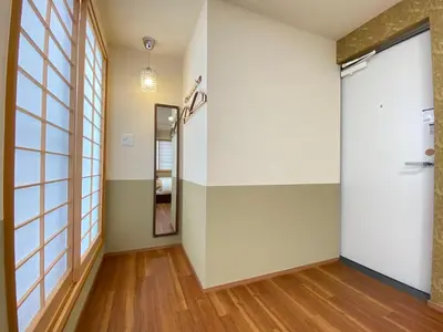 a hallway with a glass door and a mirror at N9-luxury guest room in Shinjuku in Tokyo