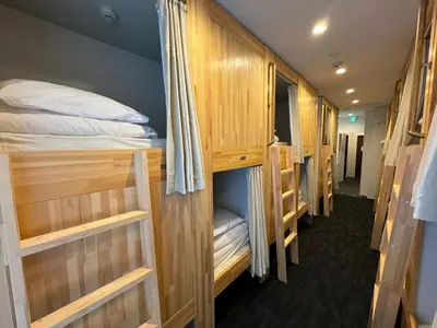 a row of bunk beds in a room at Hotel PRELE in Tokyo