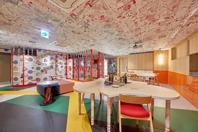 a classroom with a table and chairs in a room at lyf Ginza Tokyo in Tokyo