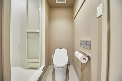 a small bathroom with a toilet and a sink at lyf Ginza Tokyo in Tokyo