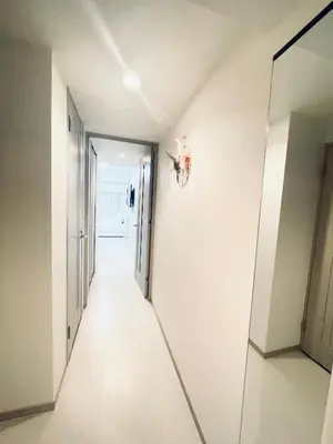 a hallway with white walls and a mirror at Shinjuku-K-SJ0060 in Tokyo