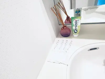 a bathroom with a white toilet and a sink at Shinjuku-K-SJ0060 in Tokyo