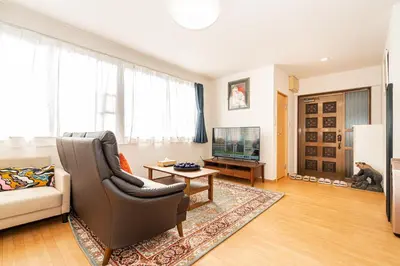 a living room with a couch and a television at Asakusa-SK-TT0322 in Tokyo