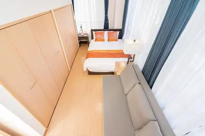 a small bedroom with a bed and a couch at Asakusa-SK-TT0322 in Tokyo