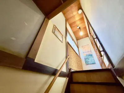 a staircase in a house with a stair case at 7\u6642IN19\u6642OUT # \u6c60\u888b\u738b\u5b50\u8d64\u7fbd\u99c5\u7121\u6599\u9001\u8fce # \u4e0a\u91ce\u99c514\u5206 # \u65e5\u66ae\u91cc\u99c510\u5206 # \u4e00\u68df\u8cb8\u5207 # \u6700\u59277\u540d A # 7 00 IN19 00 OUT # Free pick up Ikebukuro Oji and Akabane Stations # 14 min to Ueno # 10 min to Nippori # Whole house rental # Max 7 # A in Tokyo