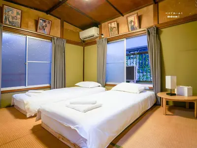 two beds in a room with two windows at 7\u6642IN19\u6642OUT # \u6c60\u888b\u738b\u5b50\u8d64\u7fbd\u99c5\u7121\u6599\u9001\u8fce # \u4e0a\u91ce\u99c514\u5206 # \u65e5\u66ae\u91cc\u99c510\u5206 # \u4e00\u68df\u8cb8\u5207 # \u6700\u59277\u540d A # 7 00 IN19 00 OUT # Free pick up Ikebukuro Oji and Akabane Stations # 14 min to Ueno # 10 min to Nippori # Whole house rental # Max 7 # A in Tokyo